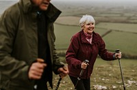 Senior couple hiking mountain, countryside, outdoor travel