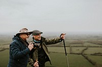 Senior nature photographers on mountain