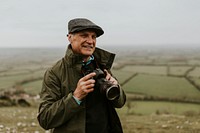 Senior nature photographer on mountain