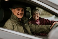 Senior couple sitting in car