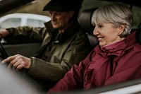 Senior couple sitting in car