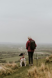 Senior woman hiking with dog