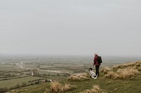 Senior woman hiking with dog