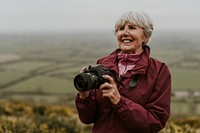 Senior woman photographer, outdoor travel