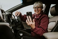 Driving senior woman video calling