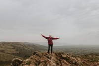 Carefree senior woman on mountain top