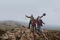 Happy seniors hiking on mountain, outdoor activity