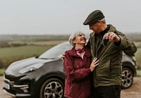 Senior couple showing car key