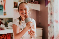 Happy girl with Down Syndrome singing