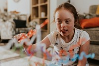 Girl with Down Syndrome playing buzz wire game