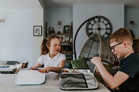 Siblings packing their lunch bags