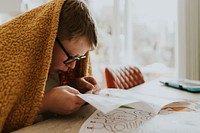 Kid flipping through his book, education photo