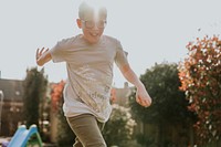 Happy boy running in playground