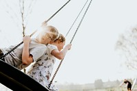 Brother & sister on swing, sibling love