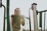 Happy boy having fun, playground photo