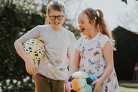 Happy siblings with down syndrome sister