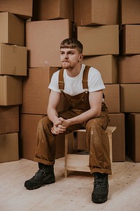 Moving service provider, man in overalls, job & career photo