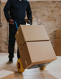 Moving worker unloading boxes into new home