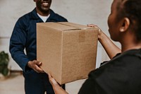 Delivery man handing box to customer