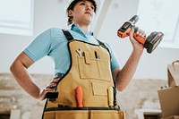 Construction worker wearing handyman apron with tools