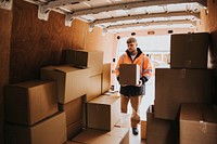 Moving worker unloading boxes from truck