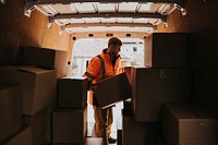 Moving worker unloading boxes from truck