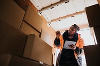 Moving worker checking boxes, job & career photo