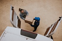 Delivery man handing box to customer