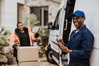 Workers unloading boxes, removal service job