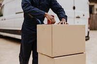 Worker unloading boxes, removal service job