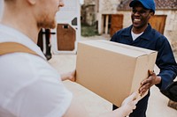 Delivery man handing box to customer