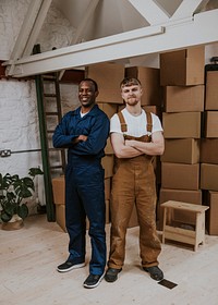 Professional moving service workers smiling