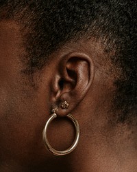 African woman wearing hoop earring, accessory photo