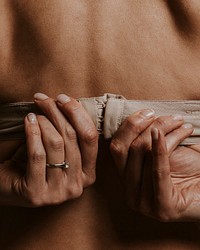 Woman wearing bra, closeup rear view photo