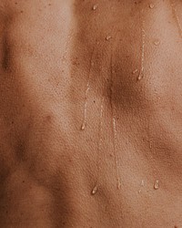 Closeup back, wet human skin texture photo