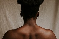 African woman's bare neck & shoulders, rear view photo