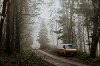 Parked van in foggy forest, wilderness