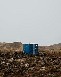 Mysterious blue container in desert