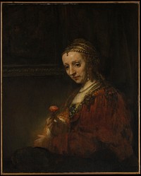 Woman with a Pink by Rembrandt van Rijn