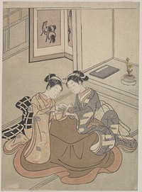 Two Young Women Seated by a Kotatsu Playing Cat's Cradle by Suzuki Harunobu