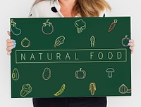 People holding a board about healthy nutrition Veggie