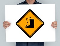 Studio Shoot Holding Banner with Safety Boots Attention Sign