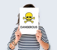 People holding placard with skull icon and chemicals dangerous