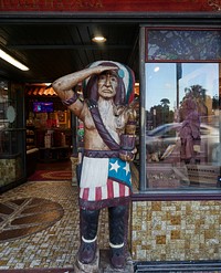                         A classic "cigar store Indian"  outside an actual cigar store on Calle Ocho (SW 8th Street), the vibrant artery of the historic Little Havana neighborhood of Miami, Florid                        