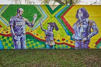                         Murals on a long wall next to the North District police station in the Liberty City neighborhood of Miami, Florida                        
