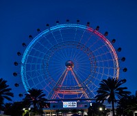                         The Wheel, a 400-foot-high (or 40-story), neon-lit Ferris wheel at dusk in ICON Park, a 20-acre, walkable entertainment destination in the Orlando, Florida's travel district                        