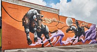                         Christian Stanley's "Unbridled Future" mural, one of several art installations in downtown Kissimmee, Florida, an old citrus-packing town south of Orlando that has grown into the home of several theme parks and other tourist attractions                        