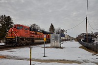                         Freight engines and their shipping-container freight cars pass the train depot in Rochelle, Illinois                        