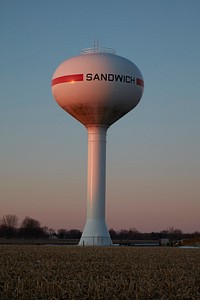                         Water tower in a town with an unusual name: Sandwich, Illinois. The town got its name when prominent local resident "Long John" Wentworth went to Congress in Washington and had the name changed from Almon to Sandwich, Wentworth's former home town                        