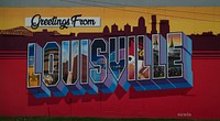                         Large sign on the wall of a business in downtown Louisville, Kentucky, welcoming visitors to the city on the Ohio River                        
